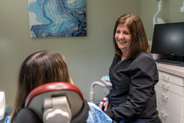 dental assistant with patient at creekside