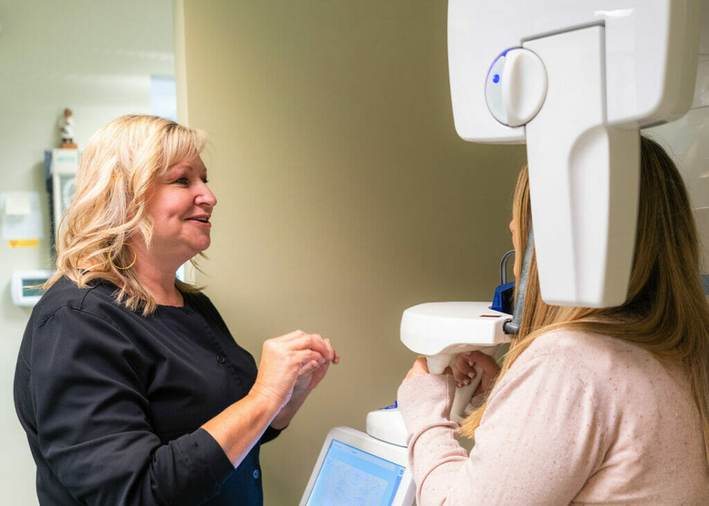 creekside team member performing dental xray